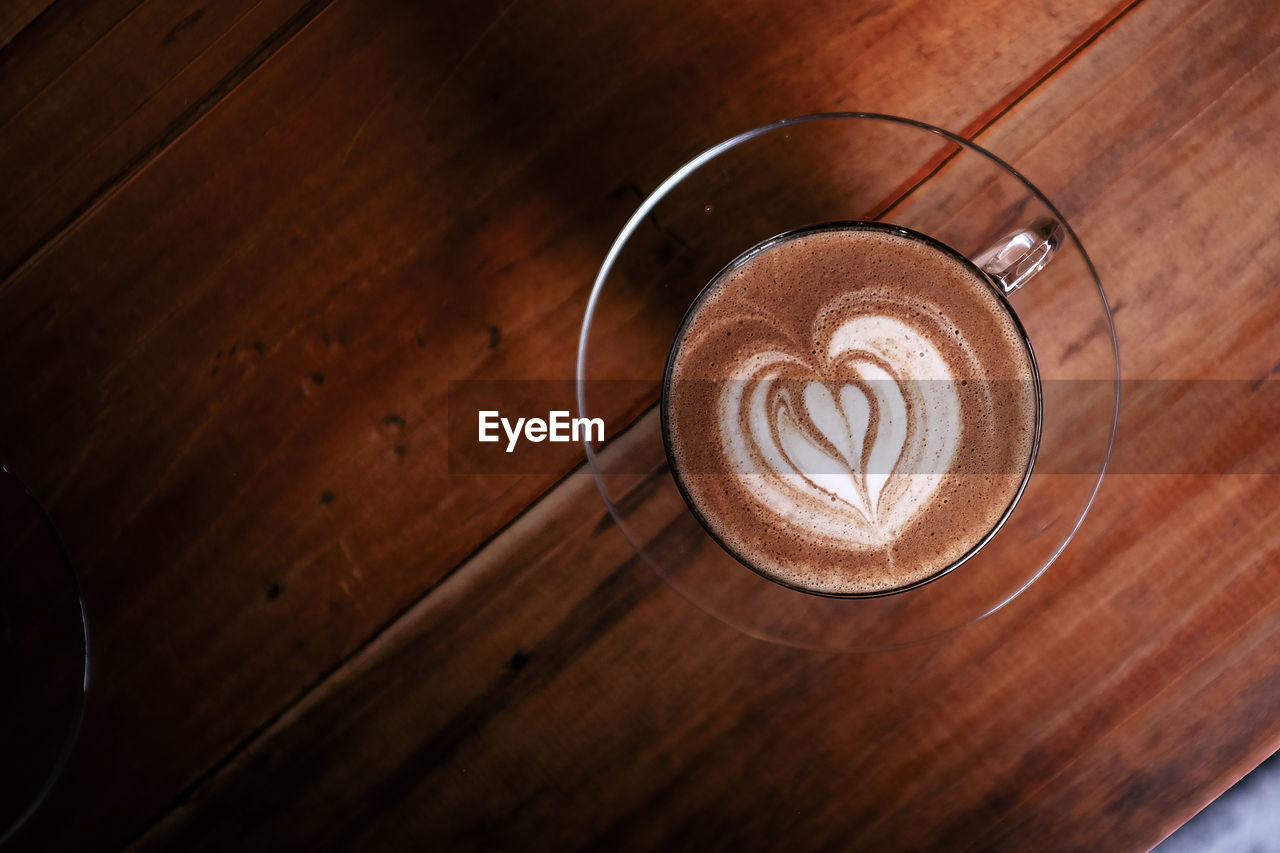 High angle view of coffee on wooden table