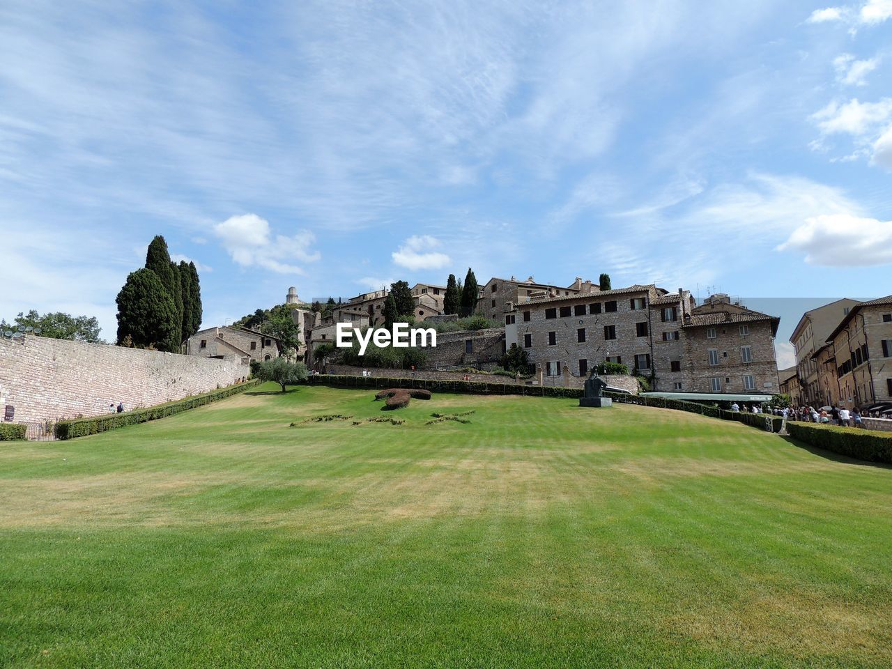 Houses on field against sky