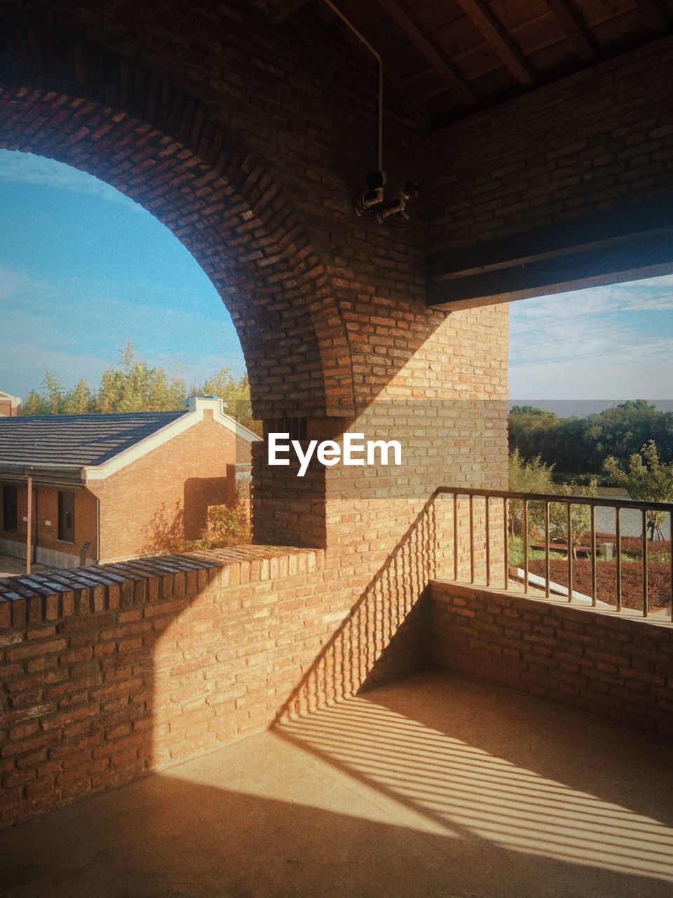 architecture, built structure, nature, building exterior, sky, arch, sunlight, no people, railing, building, city, bridge, travel destinations, estate, outdoors, shadow, day, staircase, house, wall, brick, travel