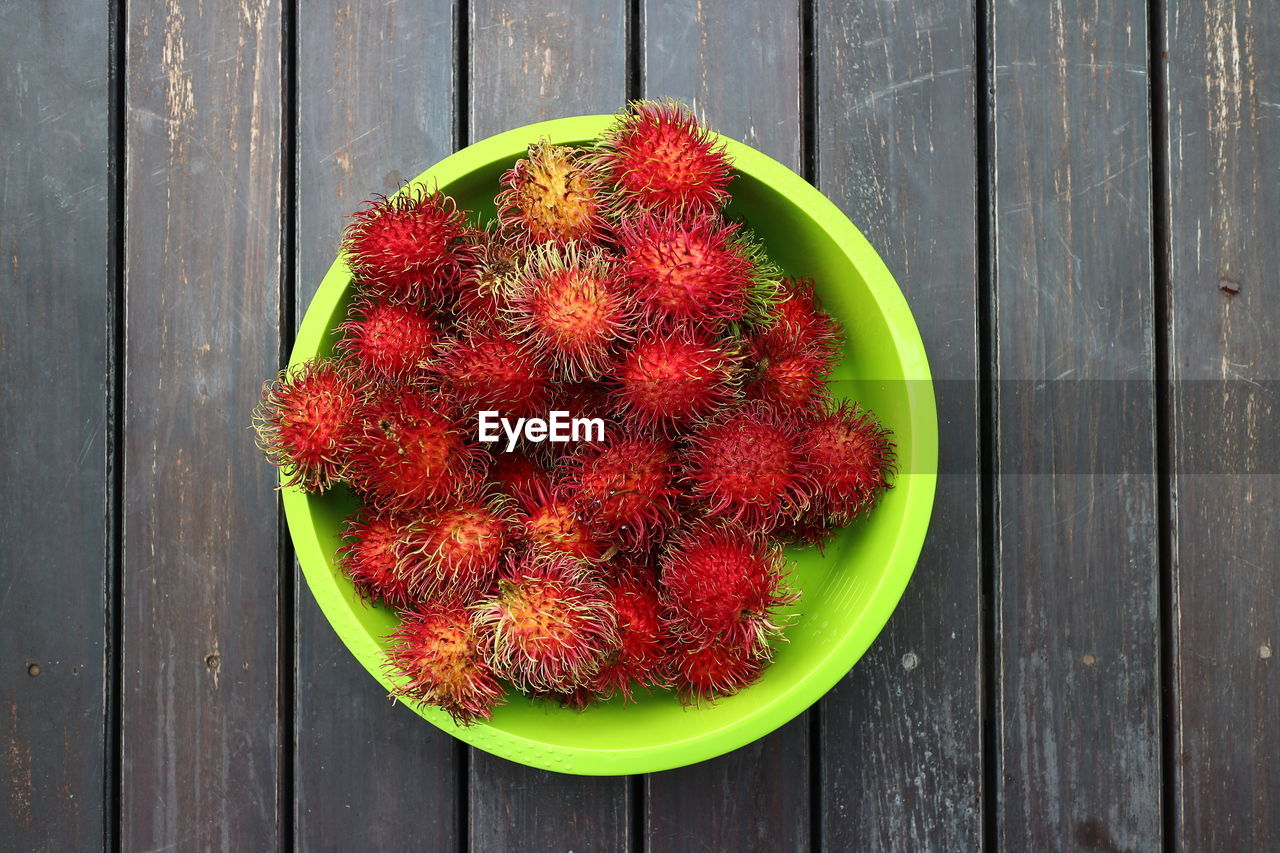 Directly above shot of rambutans in plate on table