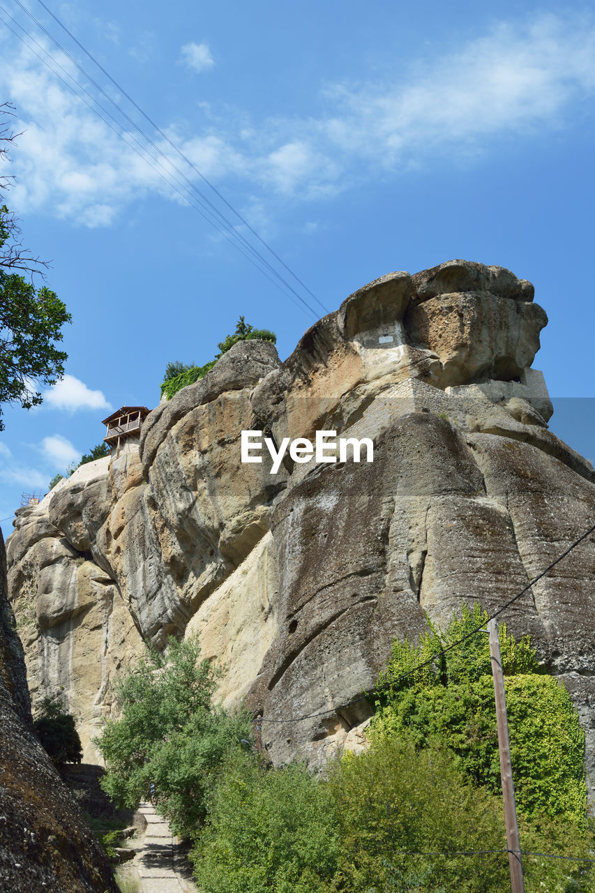 low angle view of rock formation against sky