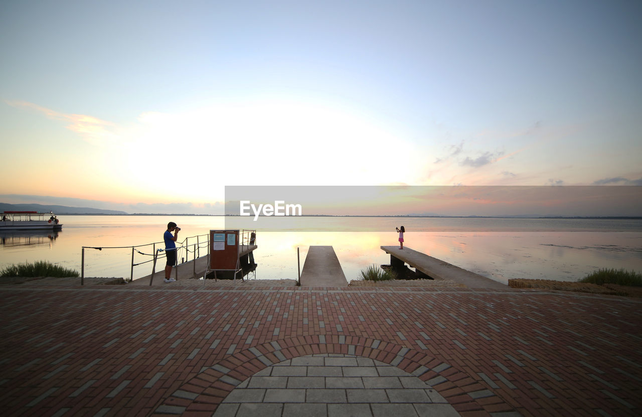 VIEW OF SEA AT SUNSET