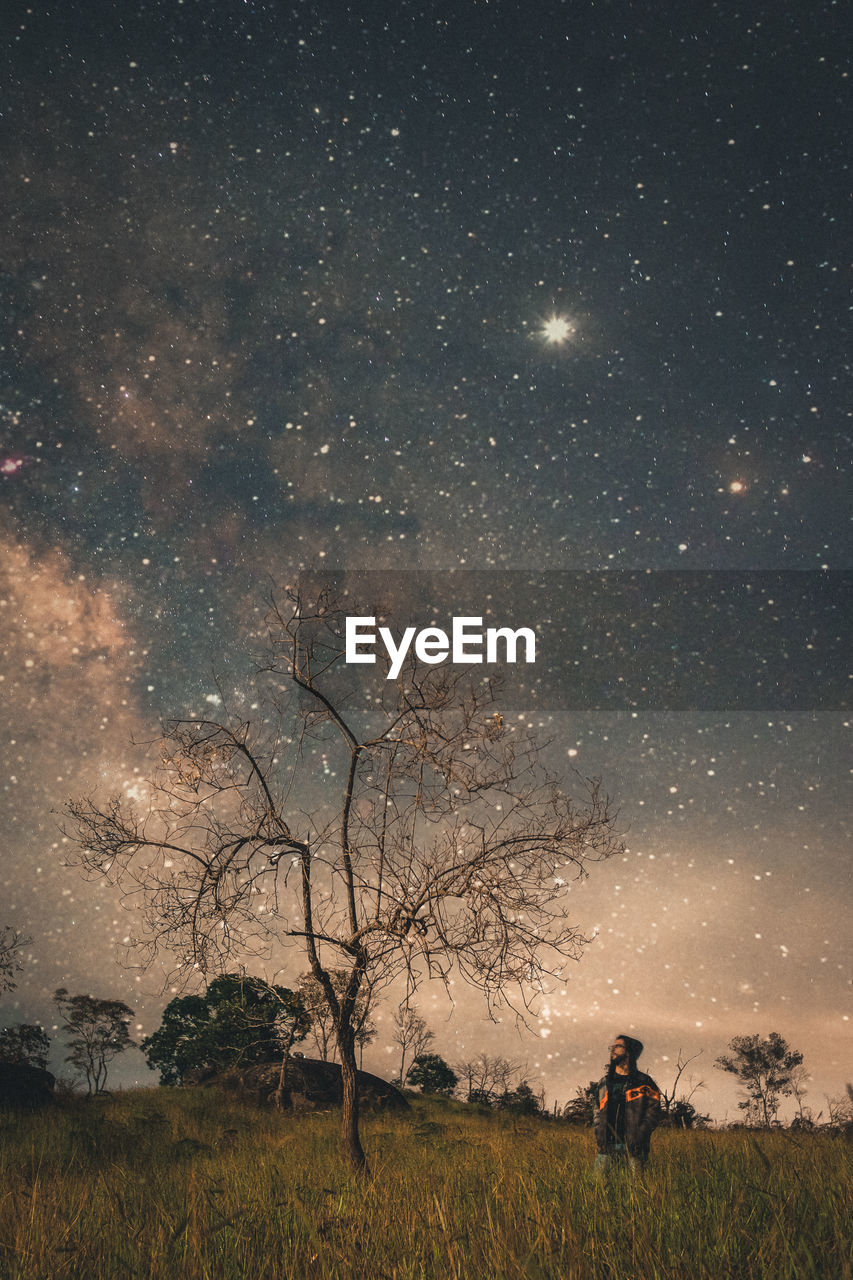 Scenic view of field against sky at night