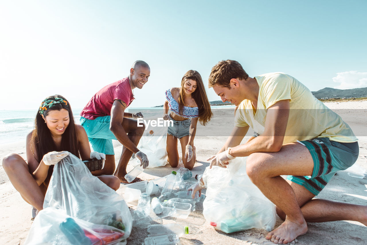 Activist picking garbage at beach