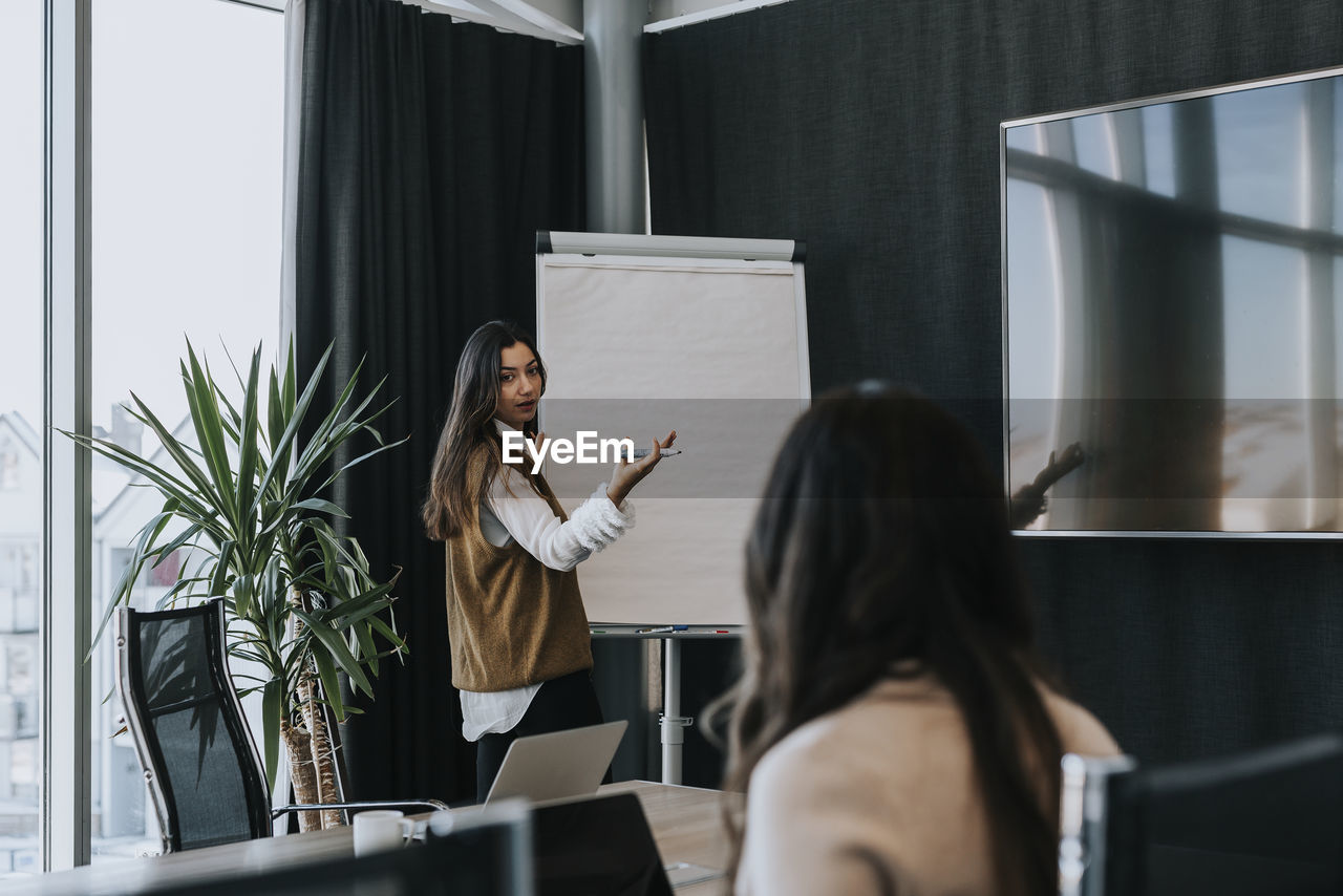 Female coworkers in boardroom
