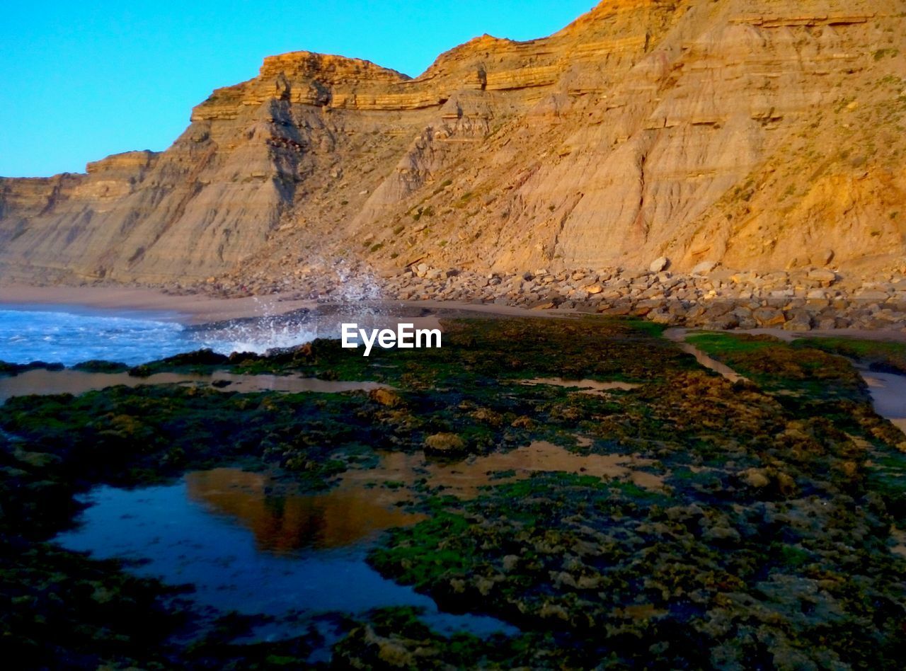 ROCK FORMATIONS AGAINST SKY