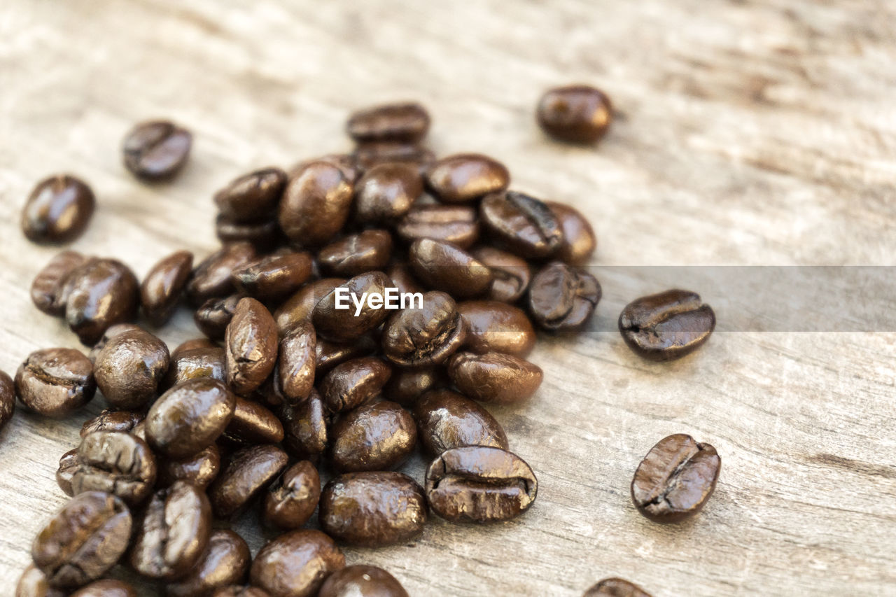 Close-up of coffee beans on table