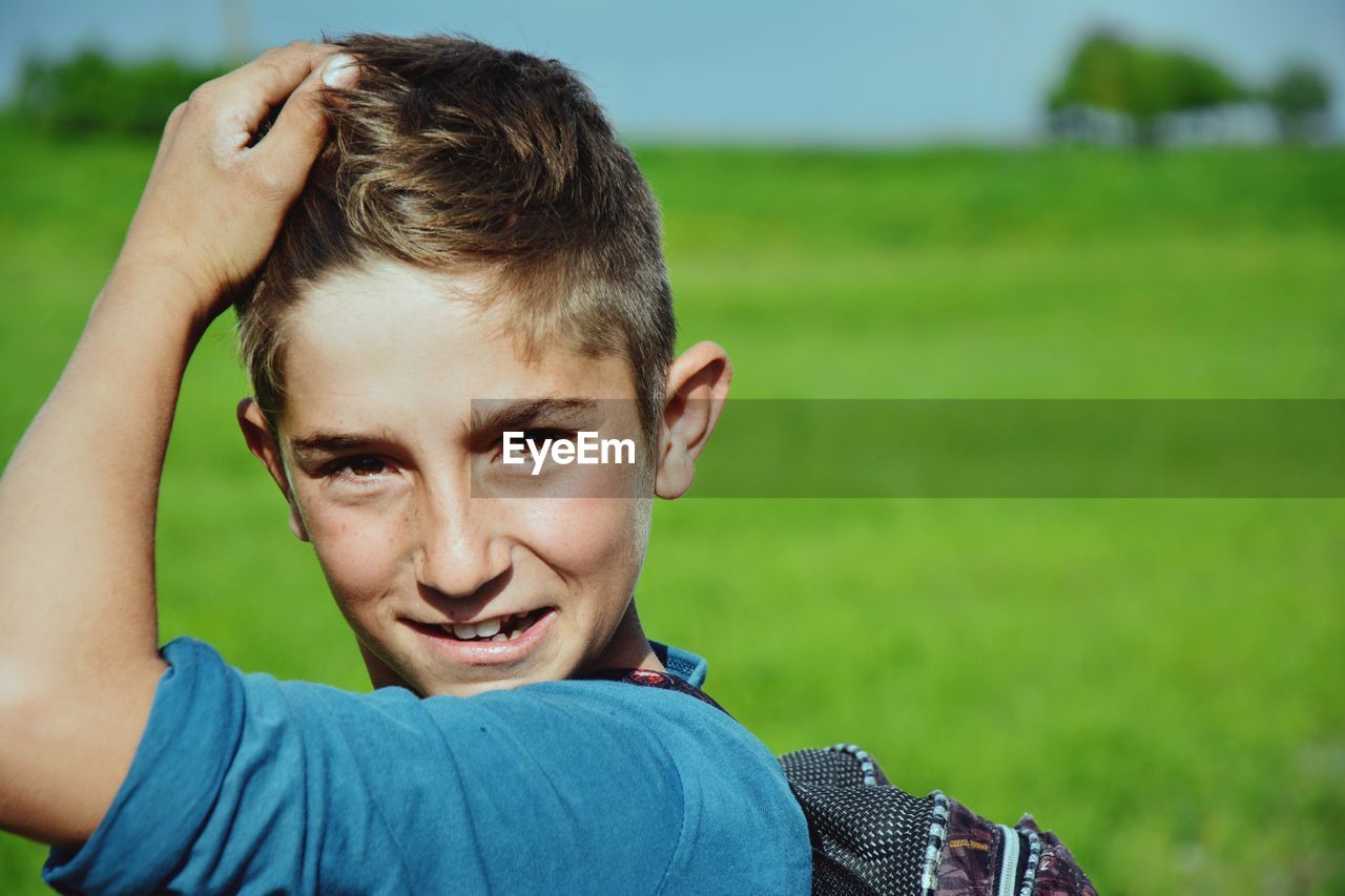 CLOSE-UP PORTRAIT OF BOY IN PARK