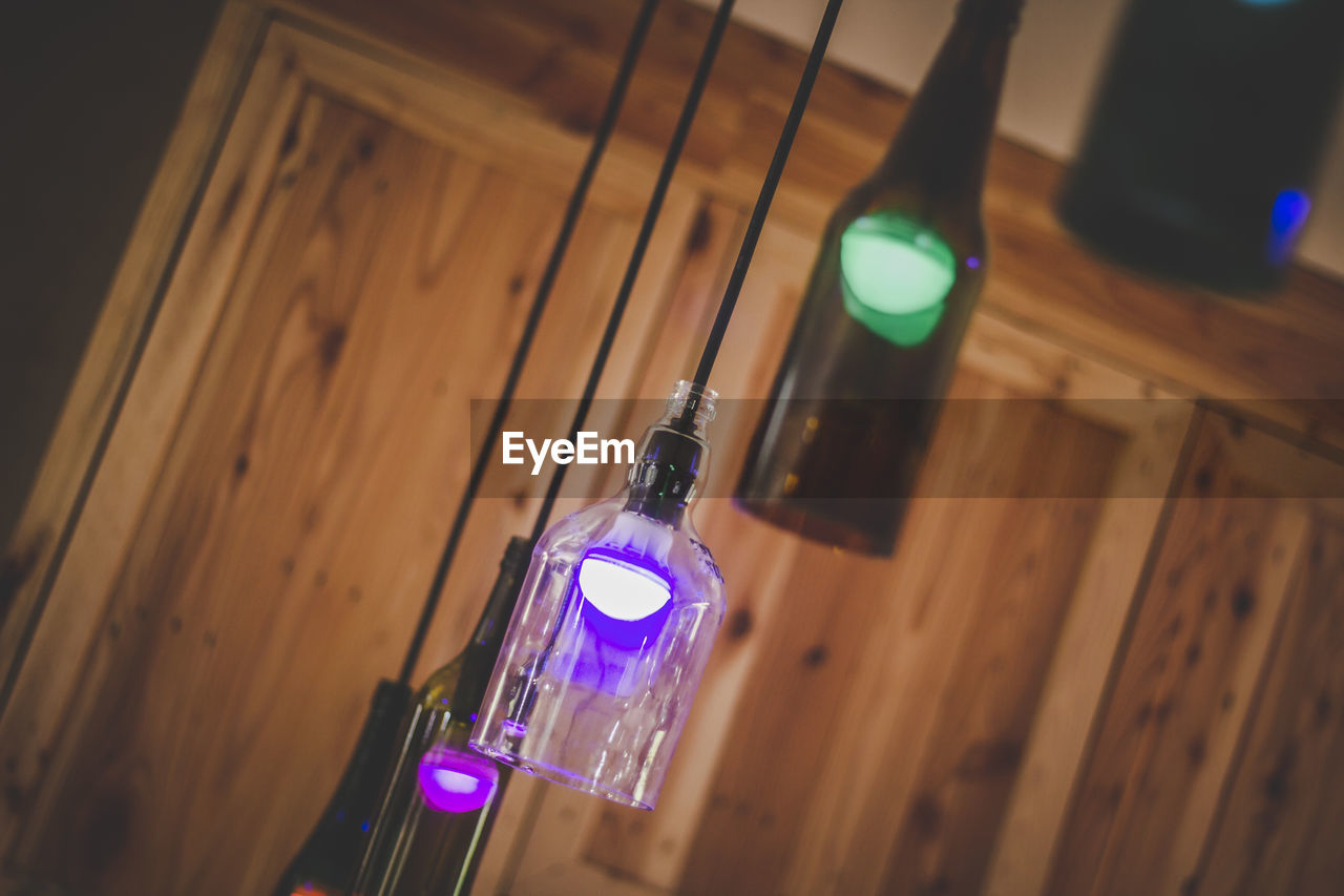 Low angle view of illuminated light bulb at home