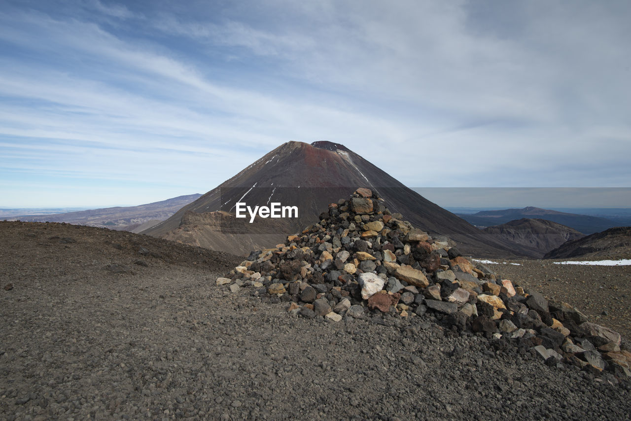 SURFACE LEVEL OF ROCKS AGAINST SKY