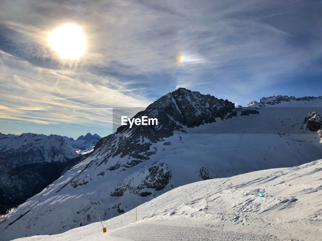 Scenic view of snowcapped mountains against sky