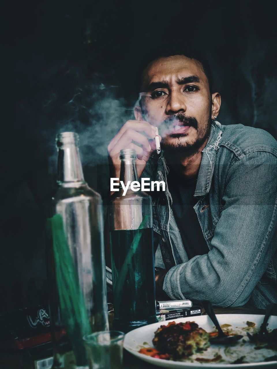 PORTRAIT OF A YOUNG MAN SMOKING