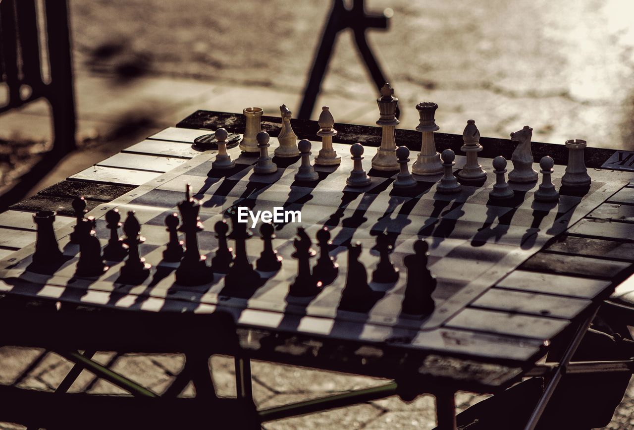 Close-up of chess board during sunset