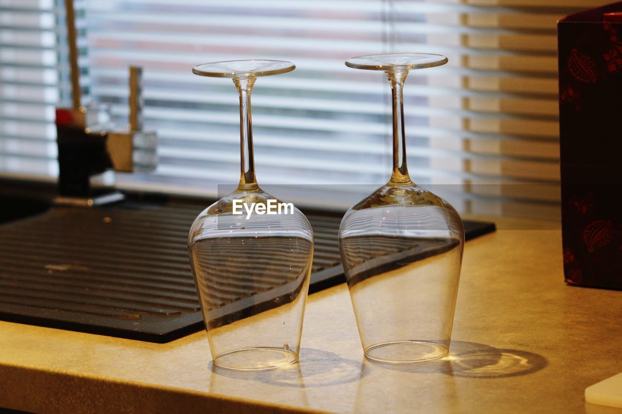 Close-up of empty wine glasses on table in restaurant