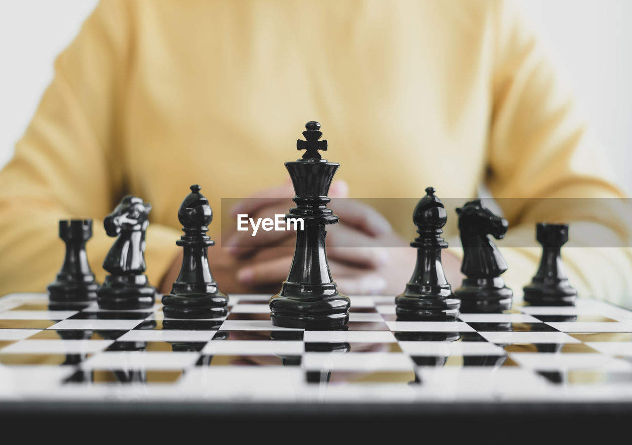 Close-up of chess playing on table