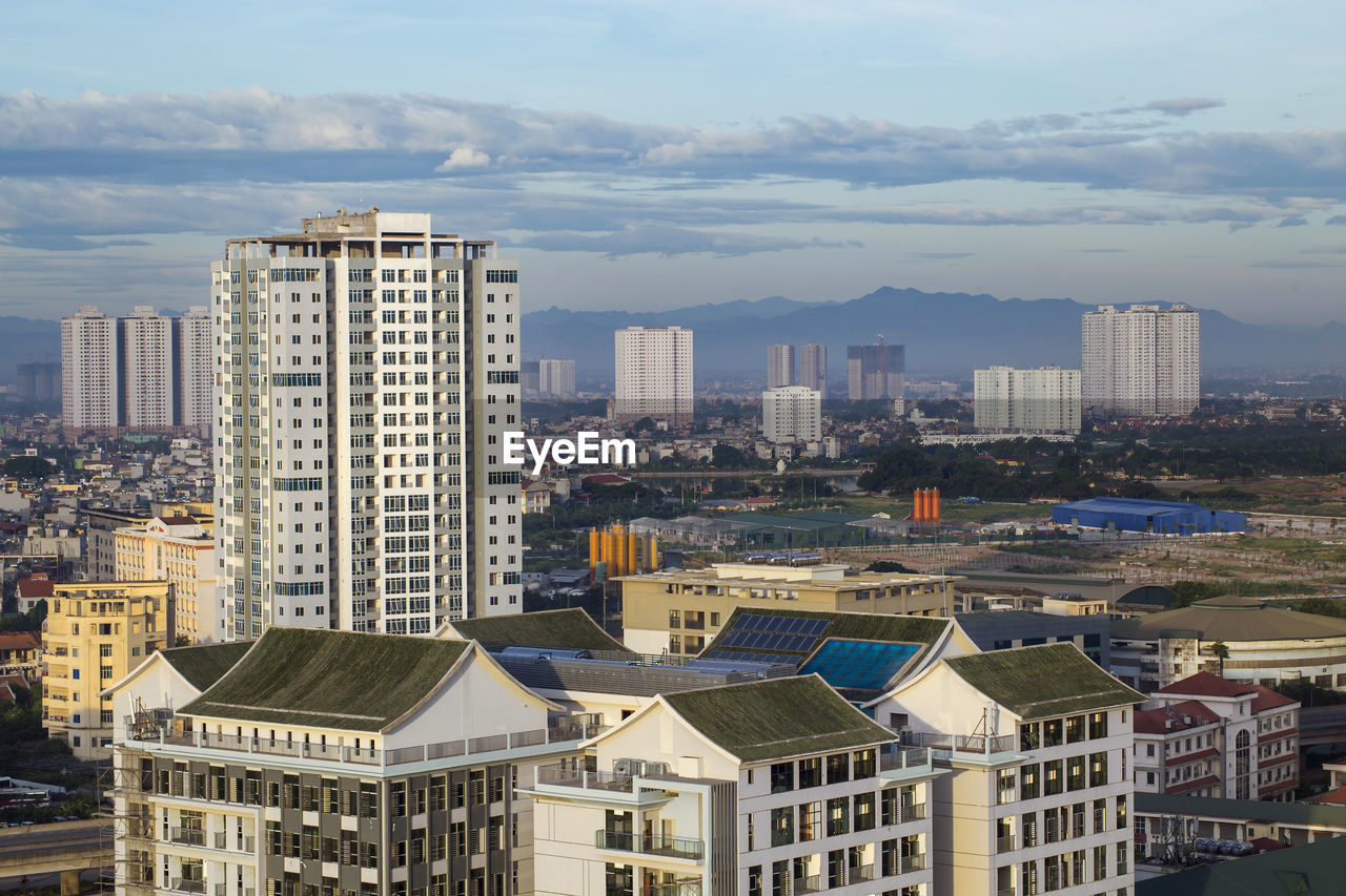 Buildings in city against sky