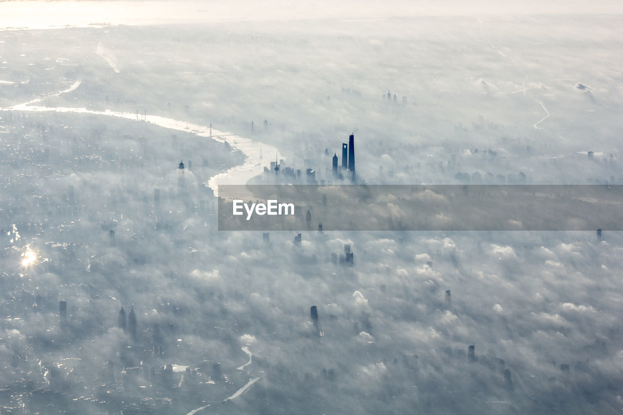 Aerial view of cityscape during foggy weather