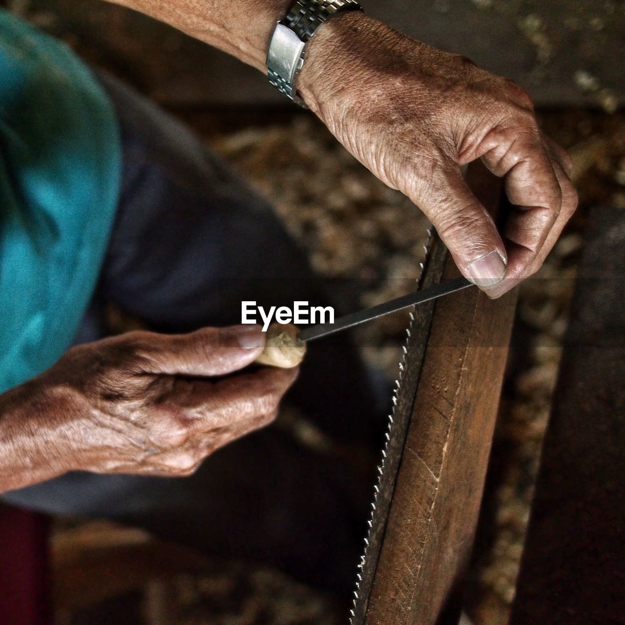 High angle view of man working on wood