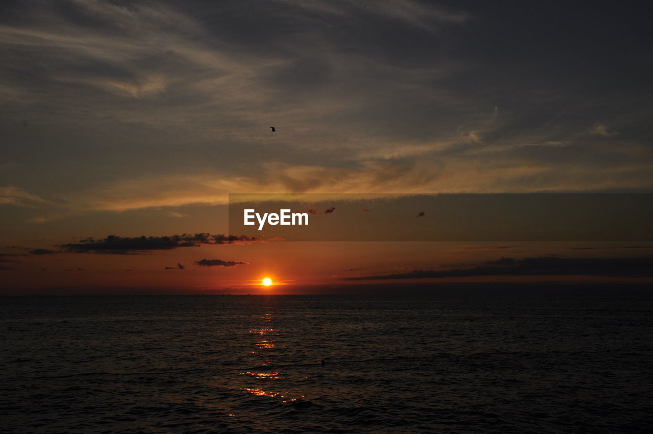 Scenic view of sunset over sea