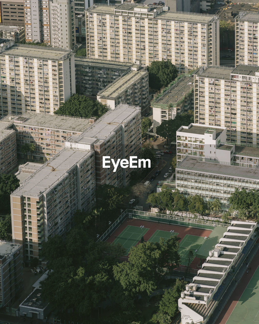 HIGH ANGLE VIEW OF BUILDINGS IN CITY AGAINST CLEAR SKY