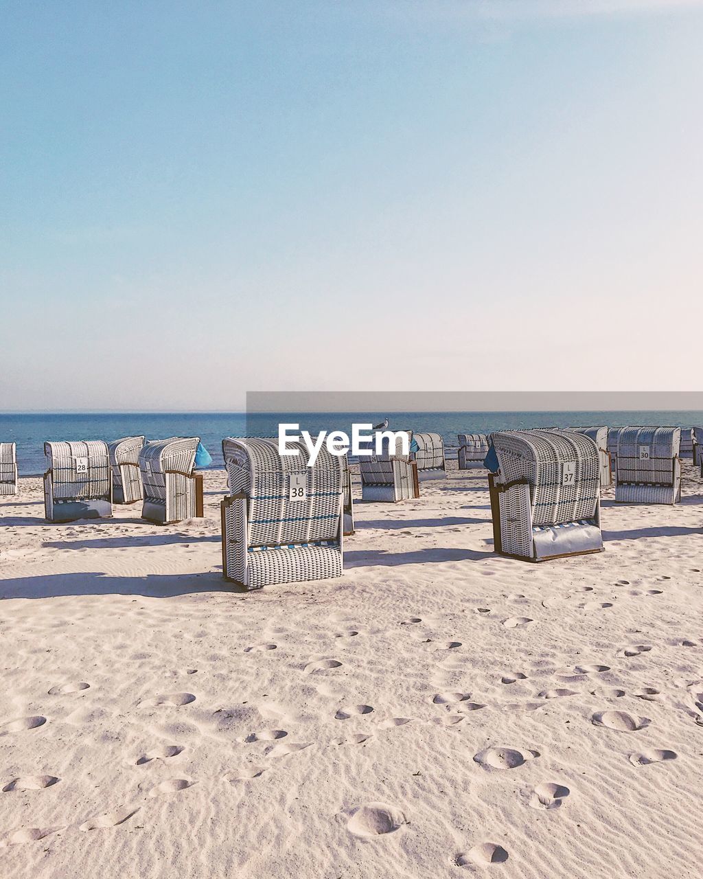 Scenic view of beach against clear sky