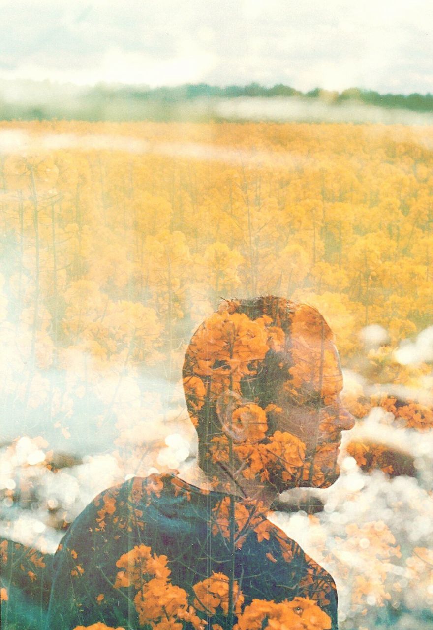 Double exposure of thoughtful man and flowers