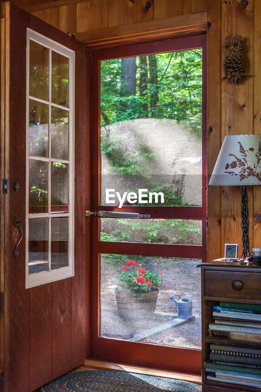 HOUSE SEEN THROUGH WINDOW