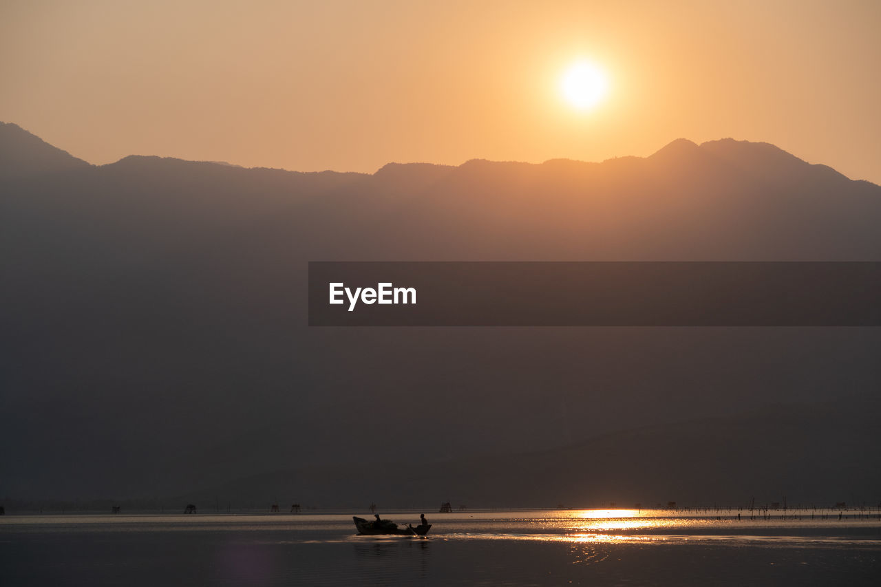 Scenic view of mountains against sky during sunset