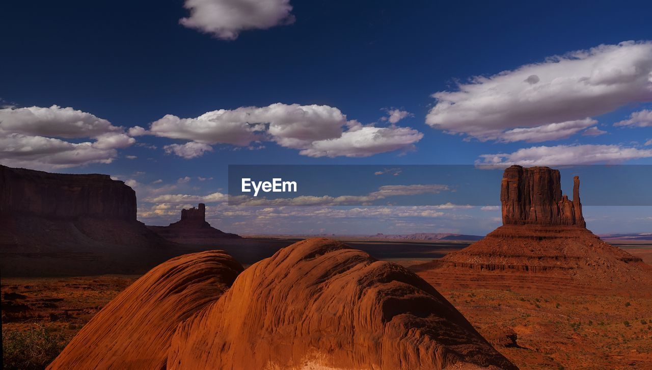 Rock formations on landscape against sky