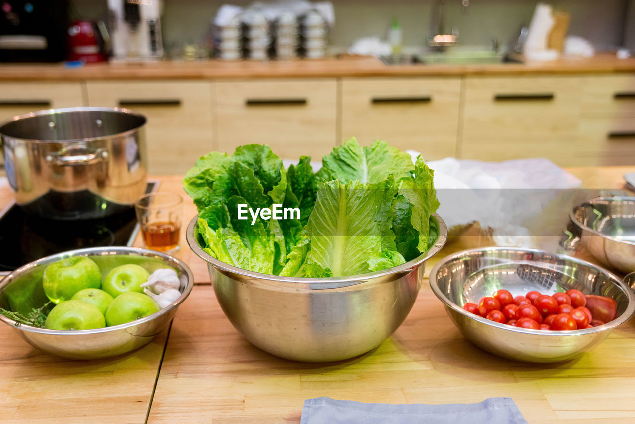 Raw foods and ingredients on the kitchen table before cooking