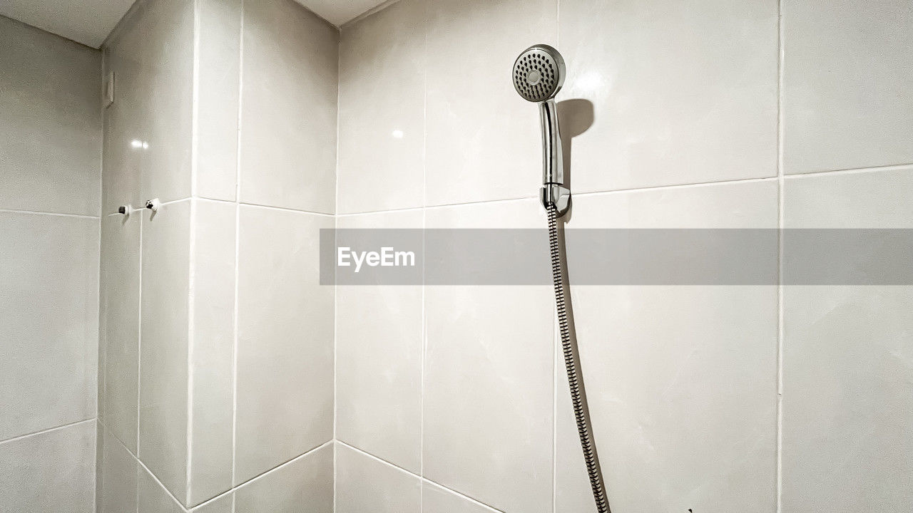 shower, plumbing fixture, bathroom, indoors, floor, tile, flooring, room, home, domestic room, wall - building feature, domestic bathroom, no people, architecture, home interior, wall