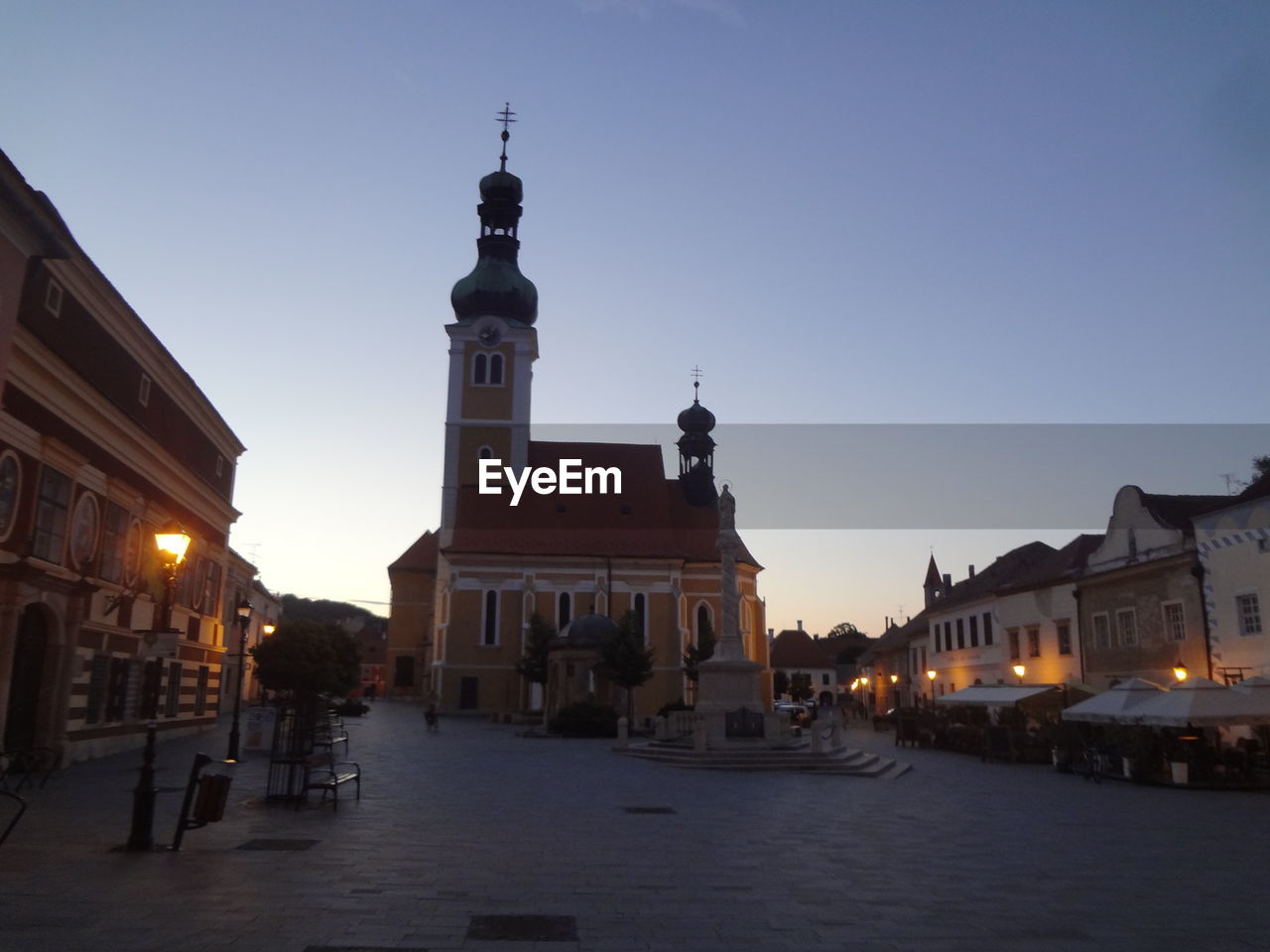 VIEW OF TOWN LIT UP AT NIGHT