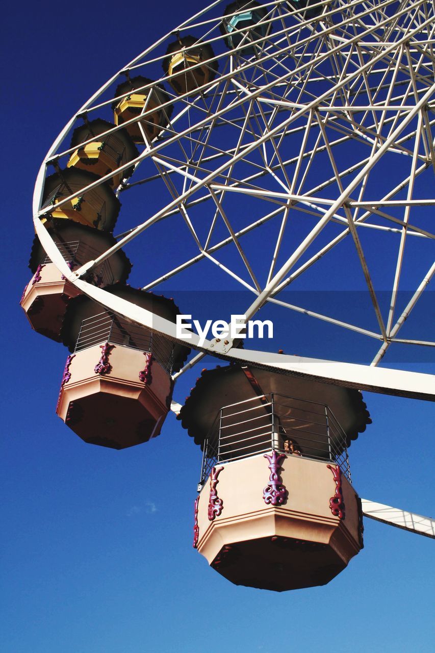 LOW ANGLE VIEW OF FERRIS WHEEL AGAINST SKY