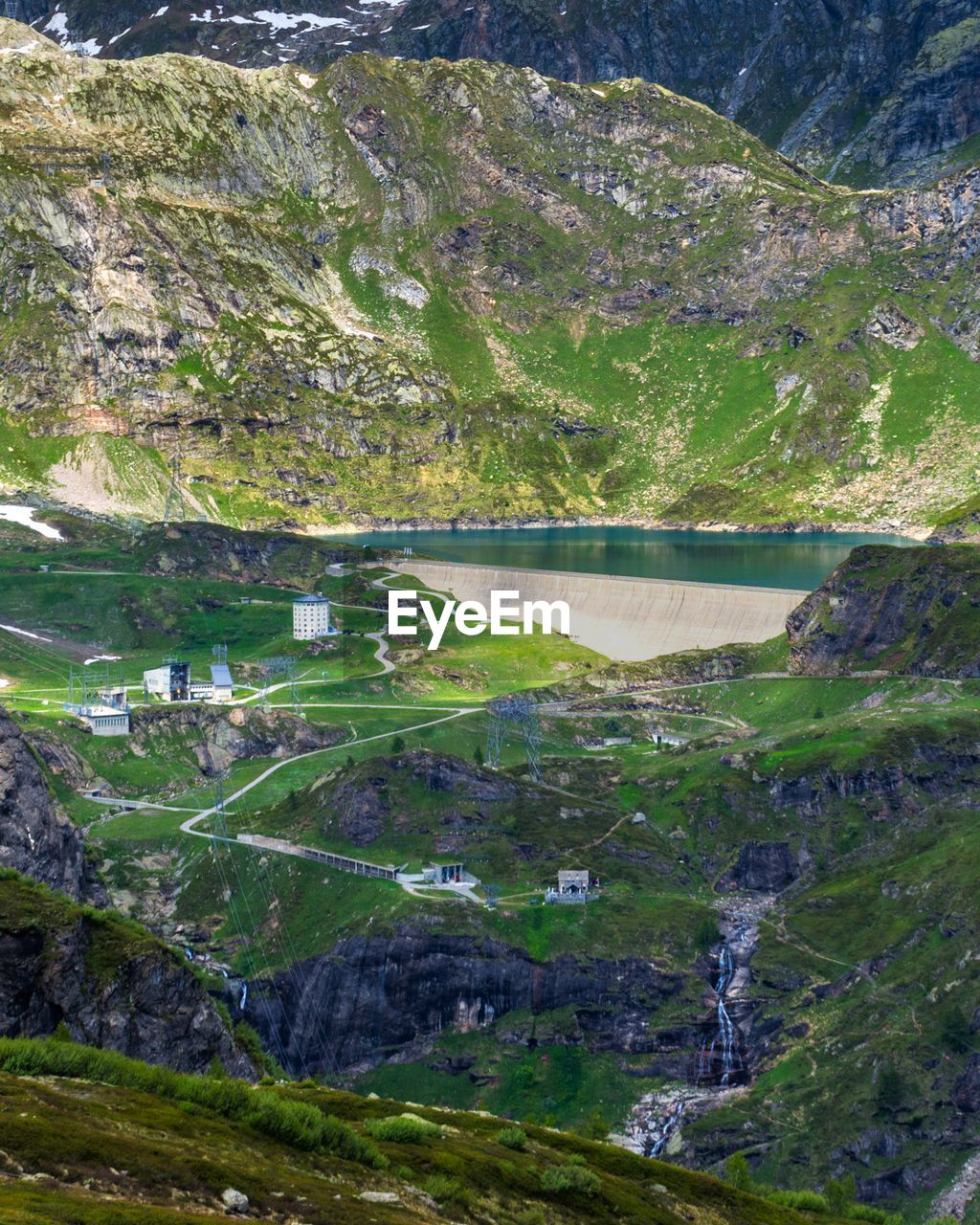 HIGH ANGLE VIEW OF LAKE AMIDST PLANTS