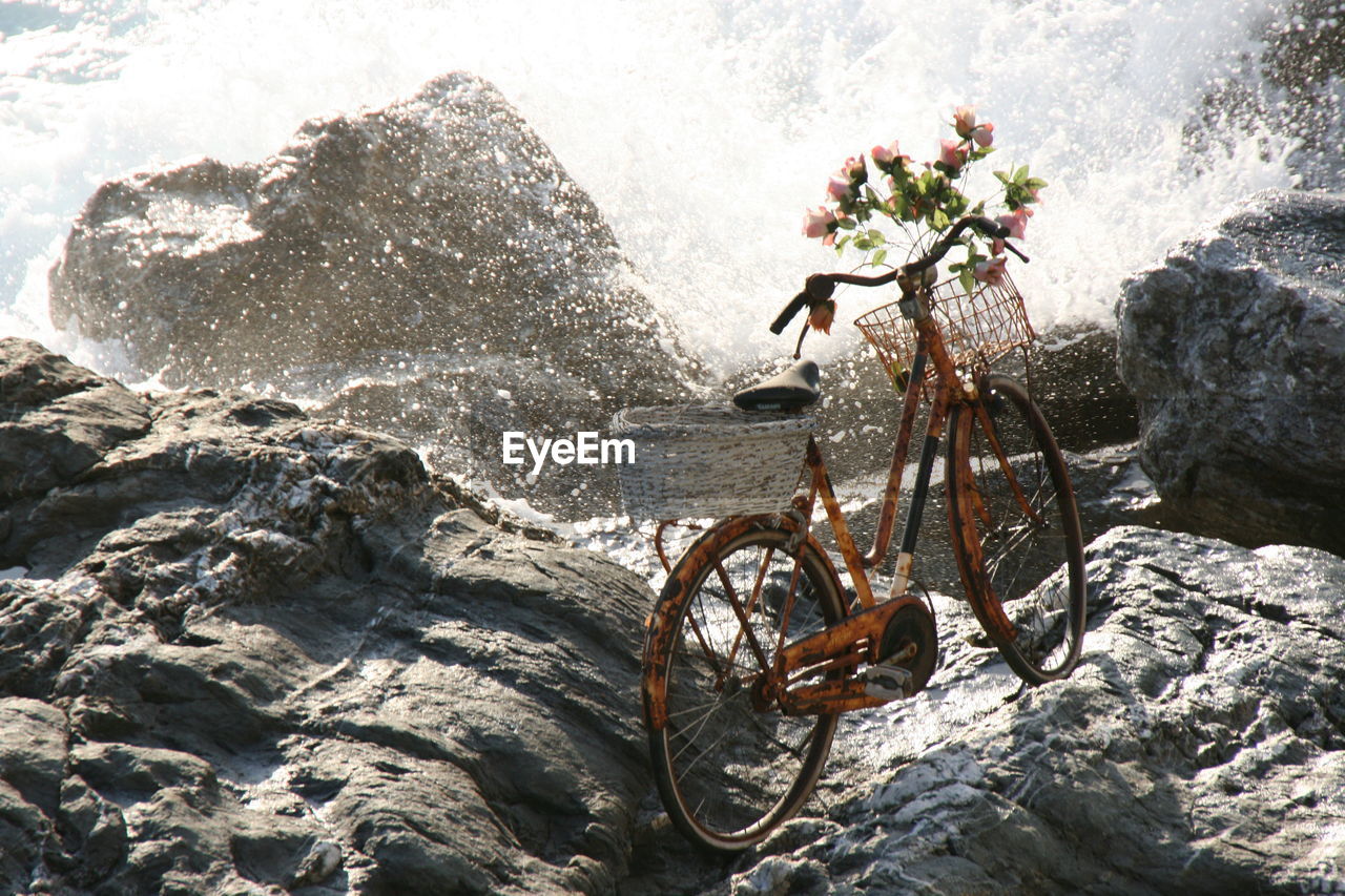 High angle view of bicycle on rocks at beach