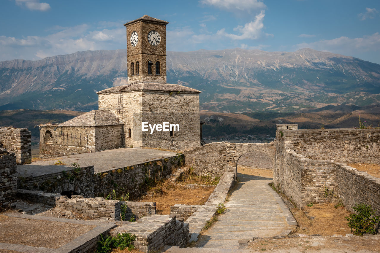 View of old building against cloudy sky