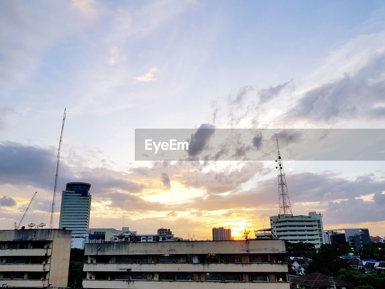 CITYSCAPE AGAINST SKY DURING SUNSET