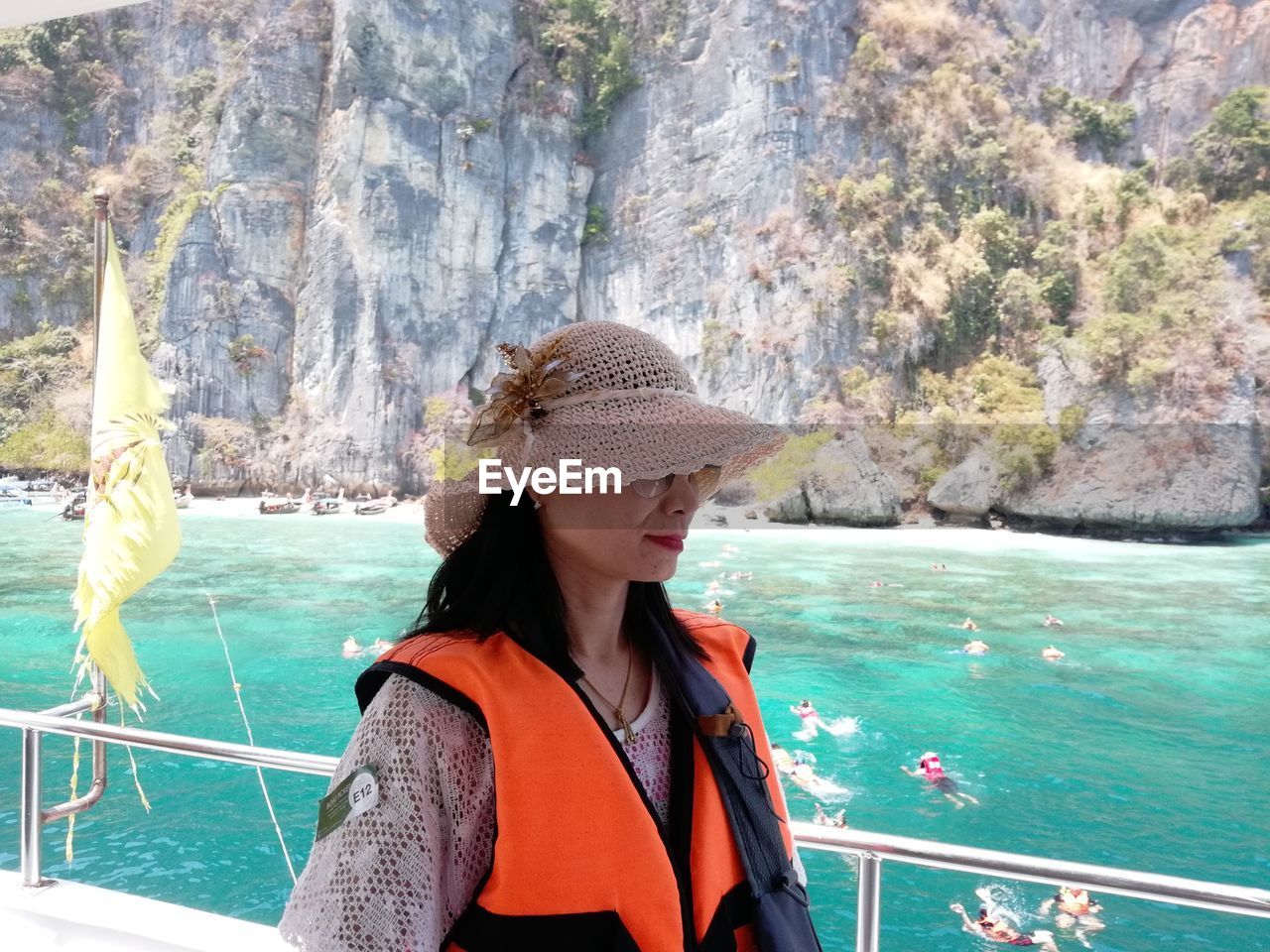 WOMAN LOOKING AT SEA SHORE