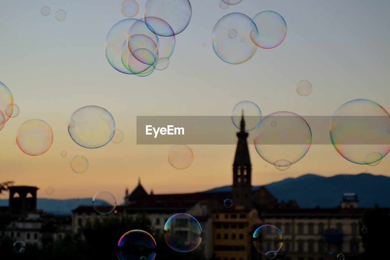 Close-up of bubbles against sky