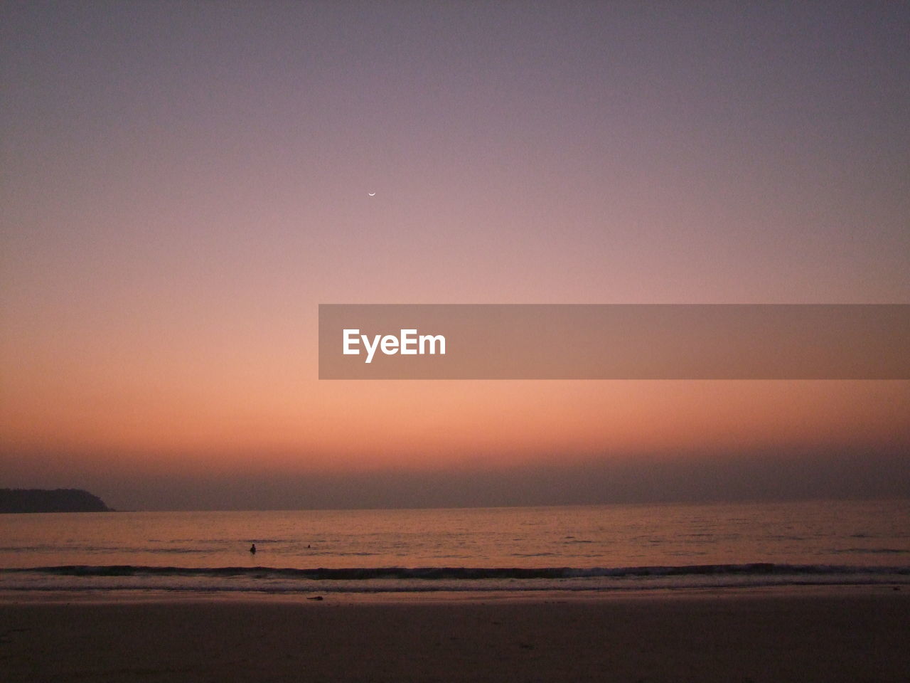 Scenic view of sea against sky at sunset