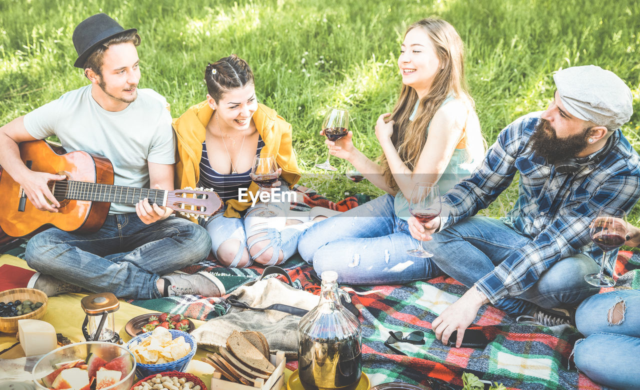 Friends enjoying picnic at park