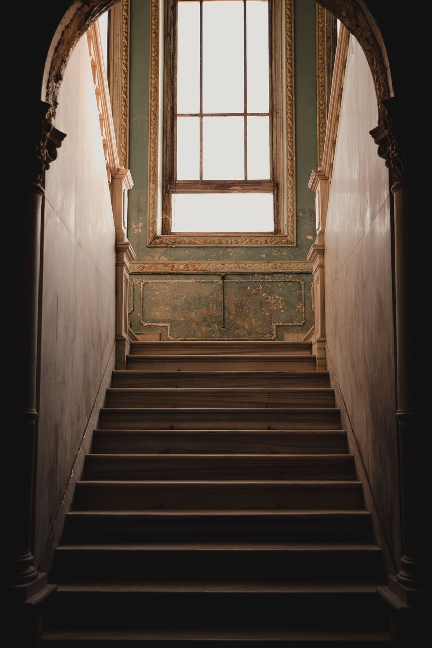 architecture, staircase, built structure, steps and staircases, indoors, light, arch, building, stairs, no people, railing, window, house, history, interior design, darkness, black, the past, entrance, the way forward, old, wood, day, low angle view