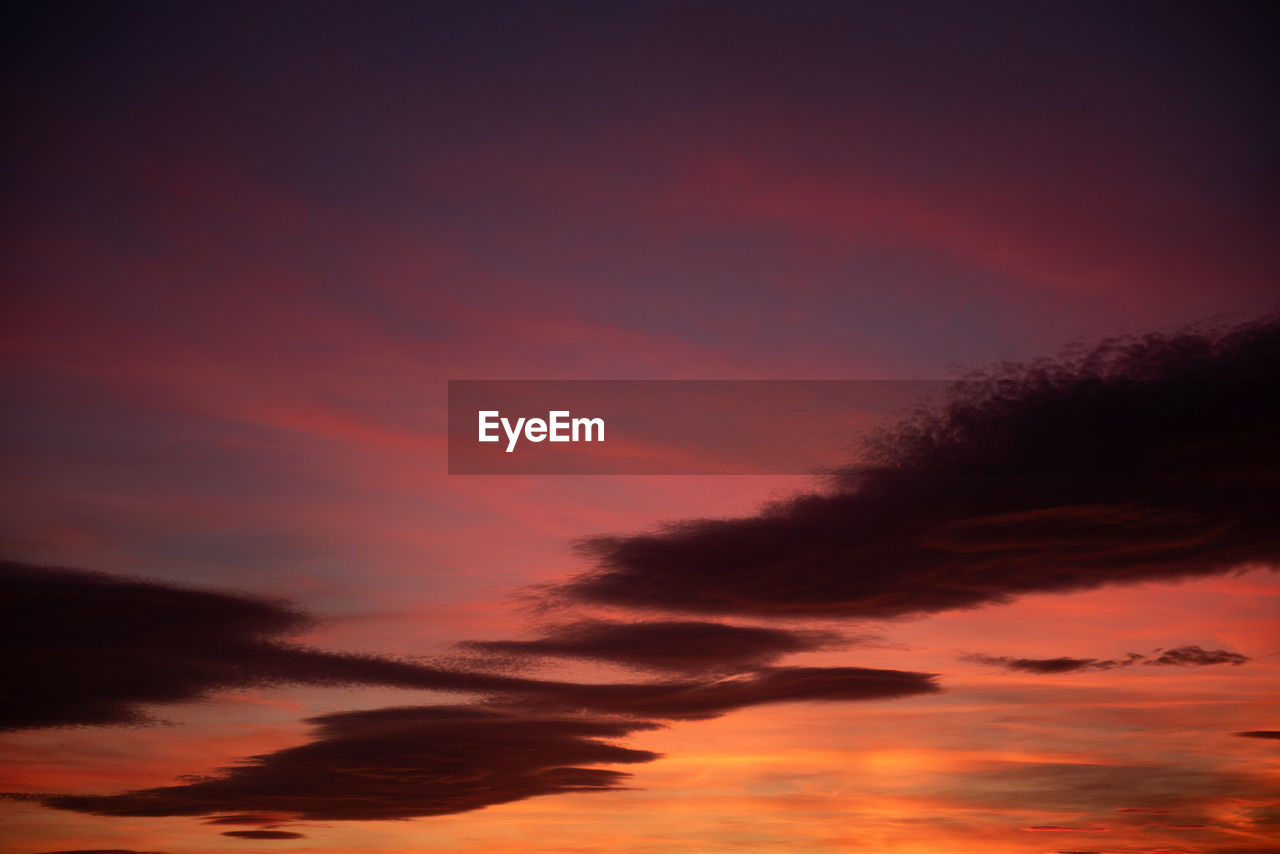 sky, sunset, cloud, beauty in nature, afterglow, red sky at morning, scenics - nature, tranquility, dramatic sky, nature, tranquil scene, orange color, no people, silhouette, idyllic, environment, dawn, evening, outdoors, atmospheric mood, red, cloudscape, dark, awe, night, romantic sky, landscape, multi colored, horizon