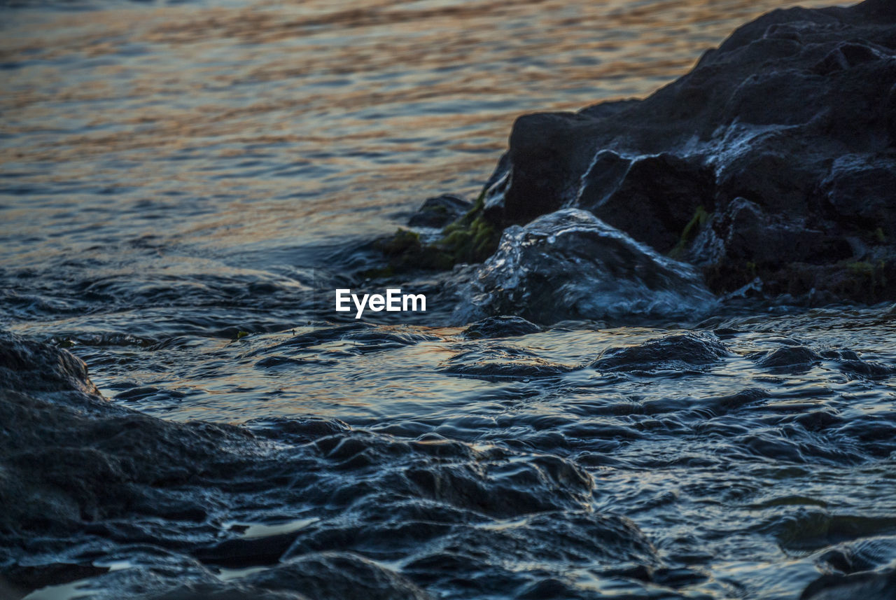 WATER FLOWING THROUGH ROCKS