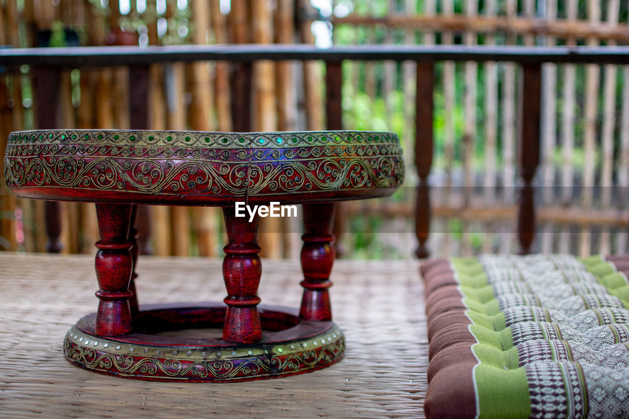 furniture, no people, focus on foreground, architecture, table, pattern, seat, wood, indoors, day, chair, religion, built structure