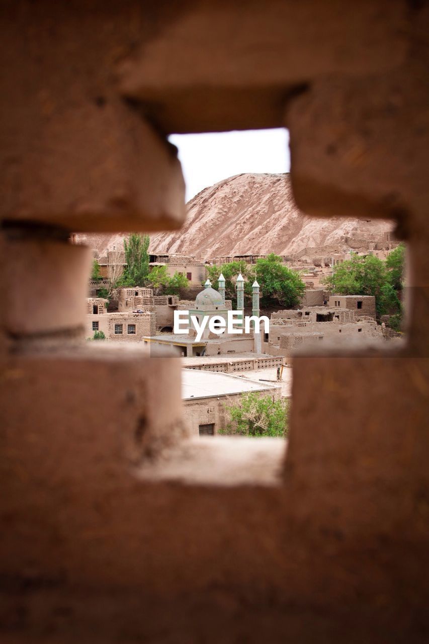 Mosque seen through cross shape window