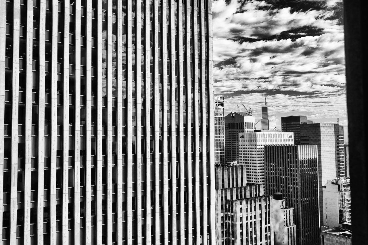 Exterior of modern buildings in city against sky