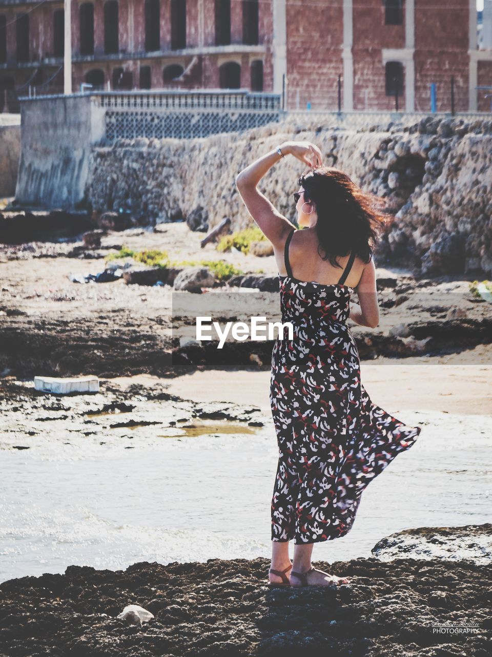 Full length of woman standing at beach