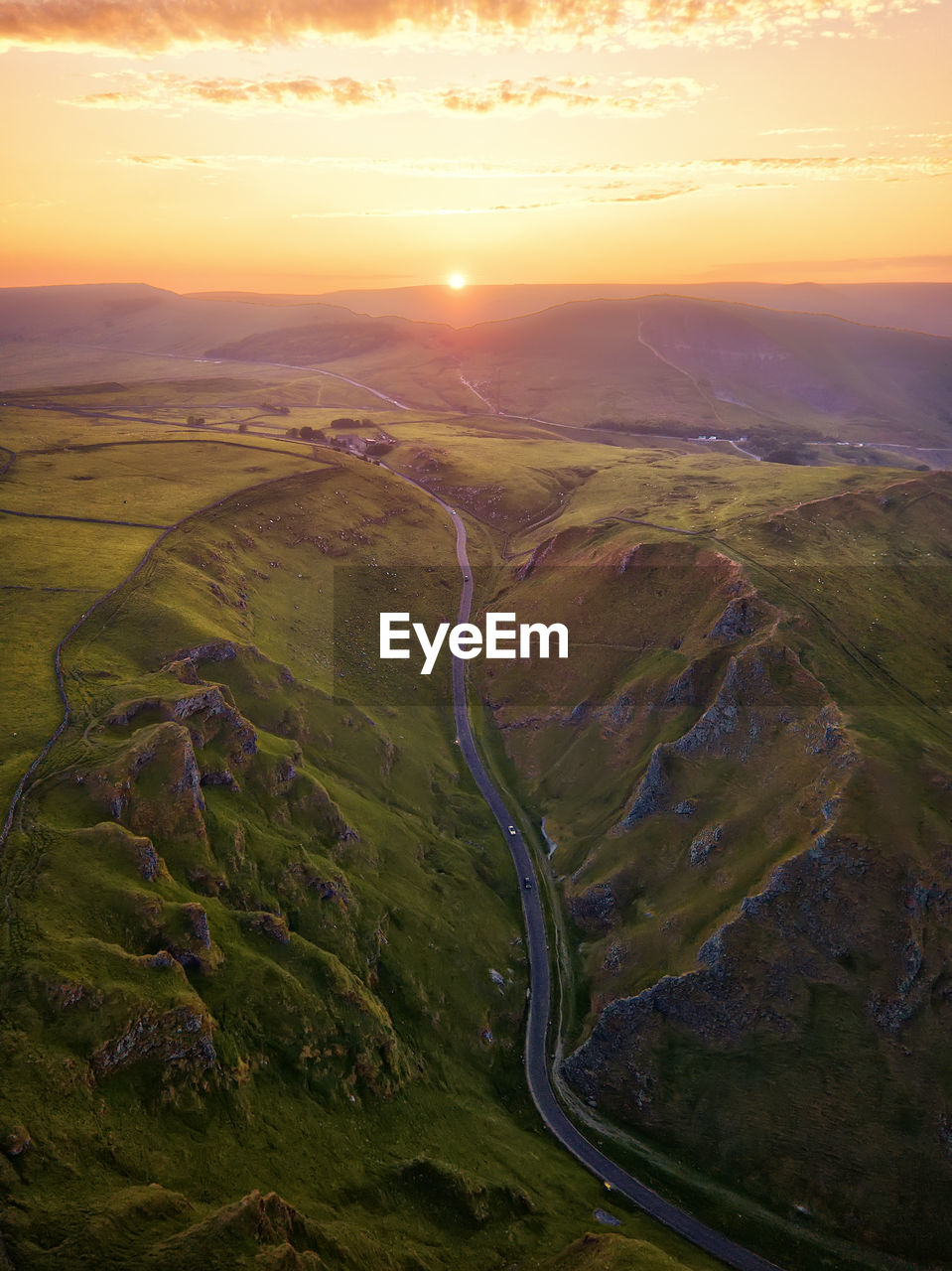 Aerial view of landscape against sky during sunset