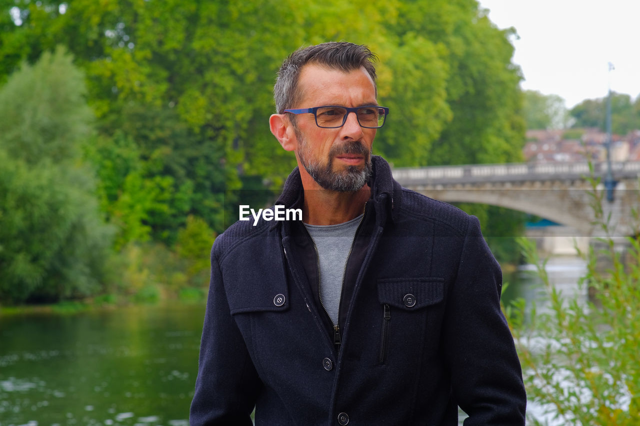 Man standing by lake